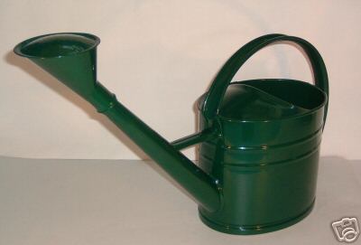 Green metal watering can